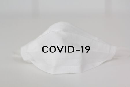 Face mask with COVID-19 writtenの写真素材
