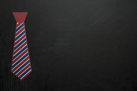 Men's tie on blackboard with copy space. Father's Day Conceptの写真素材