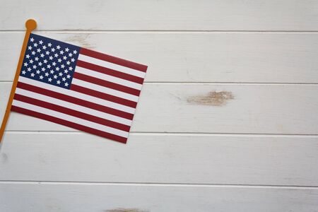 American flag on white wooden table with copy space. USA holiday, 4 of July, celebration conceptの写真素材