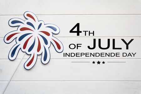 Fireworks props on white wooden table with the text 4th of July,Independence dayの写真素材