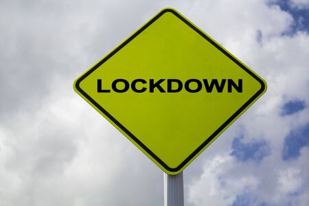 Yellow Sign with lockdown word. COVID-19 lockdown, quarantine conceptの写真素材