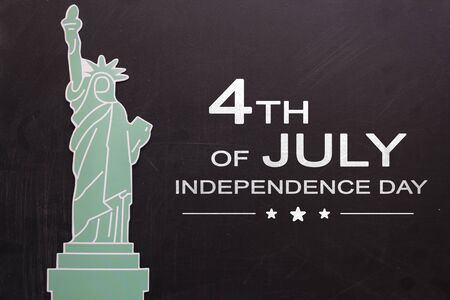 Statue of liberty on blackboard with the text 4th of July,Independence dayの写真素材