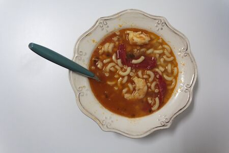 Bowl with Fish pasta soup. A Portuguese typical dish called massada de peixeの写真素材