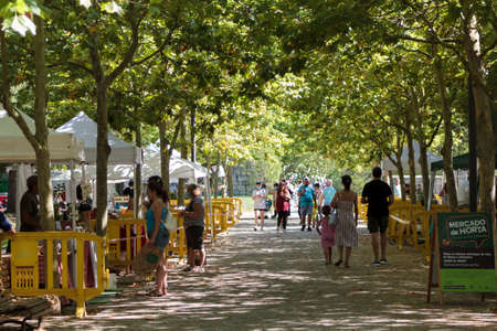 Almada, Portugal- CIRCA July, 2020: People at outdoor farmers market with organic produceのeditorial素材