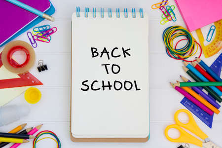 Top view of school supplies and notepad with the text Back to schoolの写真素材