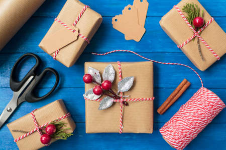 Top view of homemade christmas gifts on blue wooden tableの写真素材