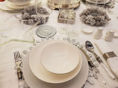 Elegant Christmas table setting in white and silverの写真素材
