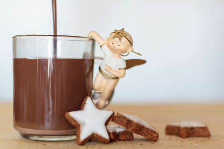 Filling a cup with hot chocolate. Winter, holiday conceptの写真素材