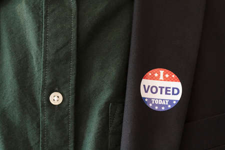 I Voted Today sticker on a man's coat lapel for the US presidential electionの写真素材