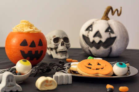 Festive table with halloween food and decorationの写真素材