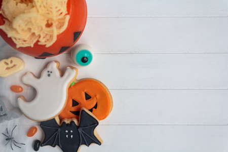 Festive Halloween table with cookies and treats. Top view with copy spaceの写真素材