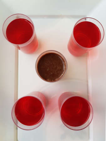 Top view of Cups with red jelly and chocolate mousseの写真素材
