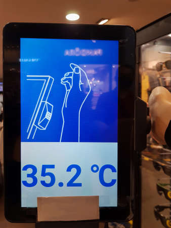 Machine to measure body temperature at the store doorの写真素材