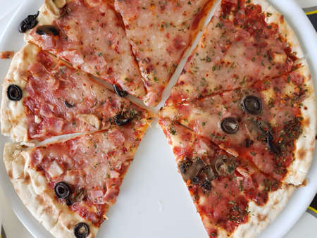 Top view of pizza missing a sliceの写真素材