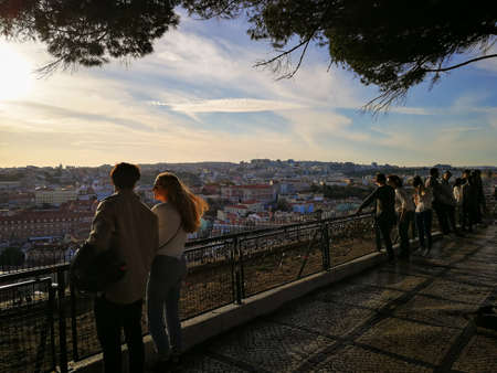 Lisbon, Portugal- CIRCA October 2020: People at the viewpoint enjoying the view of Lisbonの写真素材