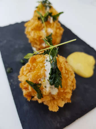 Delicious fried croquettes on table. Spanish and portuguese tapasの写真素材