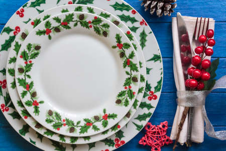 Top view of Christmas Table Setting on blue wooden tableの写真素材