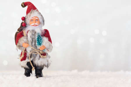 Santa Claus on snow with shiny background with copy spaceの写真素材