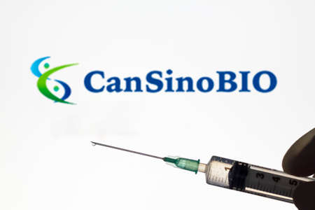 Lisbon, Portugal - November 22, 2020: Syringe and CanSino logo on the background. Coronavirus, Covid-19 vaccine conceptのeditorial素材