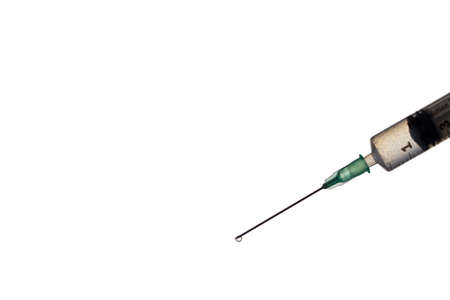 Hand holding Syringe on white background with copy space. Coronavirus, Covid-19 vaccine conceptの写真素材