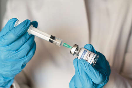 Doctor preparing Coronavirus or Covid-19 vaccineの写真素材