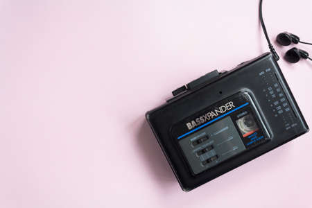 Top view of old walkman on pink background with copy spaceのeditorial素材