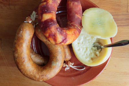 Top view of portuguese cheese from Azeitao and traditional smoked sausagesの写真素材
