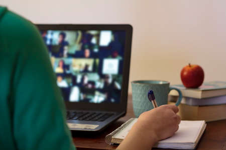 Student taking notes at online class. Concept of E-learningの写真素材