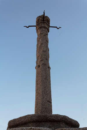 Old pillory against blue skyの写真素材
