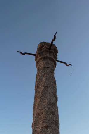 Old pillory against blue skyの写真素材