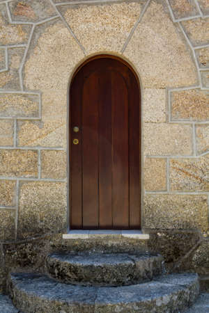 Wooden door with stone stairsの写真素材