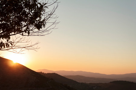 Panoramic view of hills at sunsetの写真素材