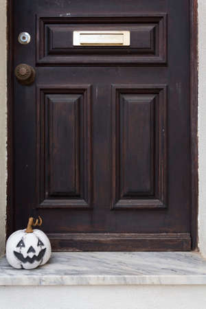 Halloween pumpkin at home front doorの写真素材