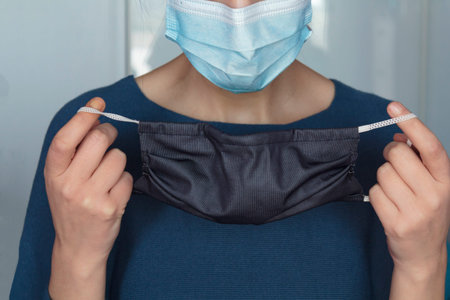 Woman putting a second face mask