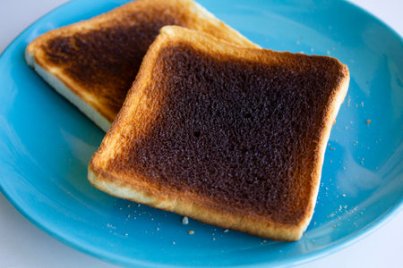Burnt toast bread on plateの写真素材