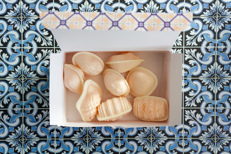Top view of box with traditional portuguese sweet called Ovos Moles de Aveiroの写真素材