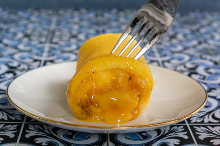 Eating a traditional portuguese sweet called Torta de Azeitaoの写真素材