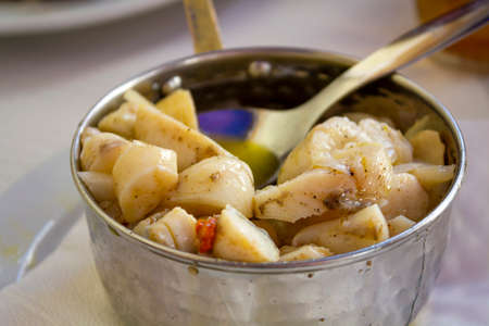 Cutllefish eggs salad on potの写真素材