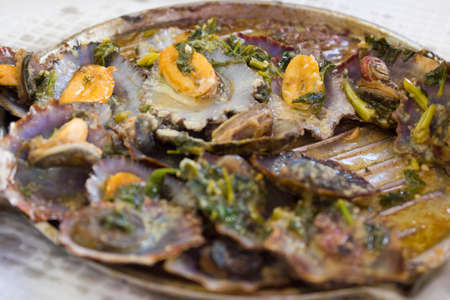 Limpets fried in a grill. Portuguese seafoodの写真素材