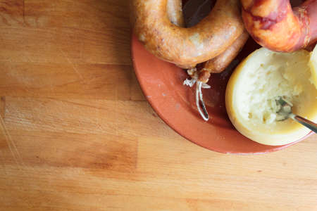 Top view of portuguese cheese and smoked sausage on wooden borad with copy spaceの写真素材