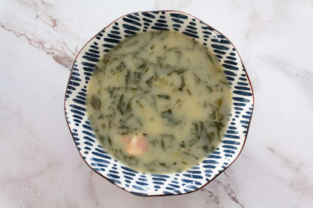 Top view of bowl with portuguese kale soup called caldo verdeの写真素材
