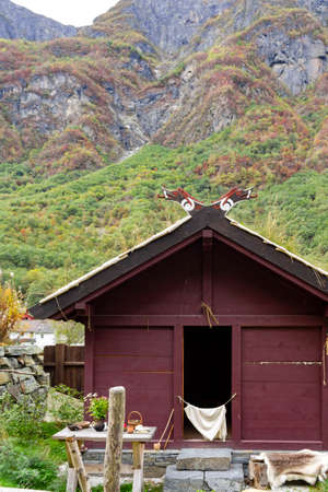 Viking house surrounded by high mountainsの写真素材