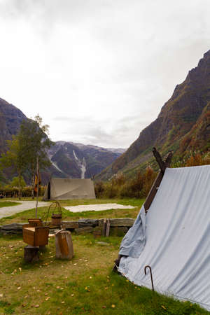 Viking tents surrounded by fjord landscapeの写真素材