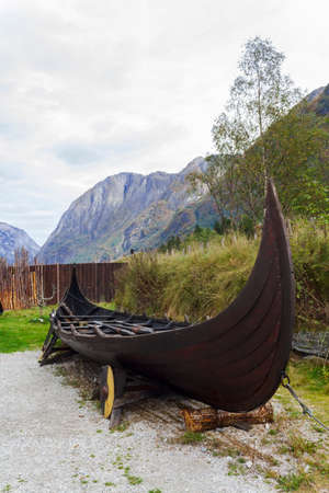 Viking ship with mountains on the backgroundの写真素材