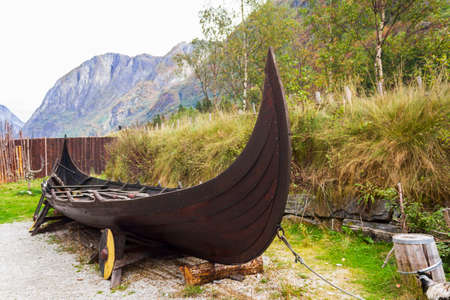 Viking ship with mountains on the backgroundの写真素材