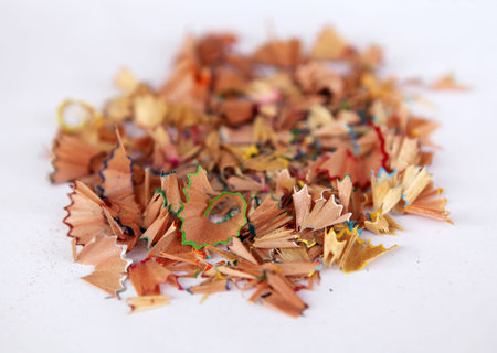 Colorful pencil shavings isolated in white backgroundの写真素材