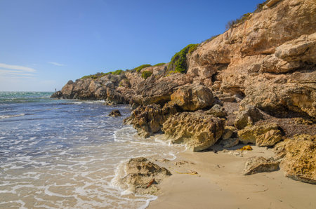 Sunny day landscape coast line cliffs at the beachの写真素材