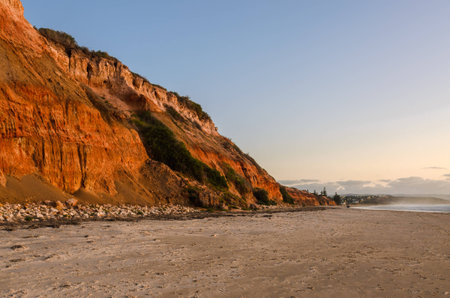 Cliffs coast line sand beach landscape at sunsetの写真素材