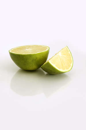 Pieces of a lime isolated over whiteの写真素材