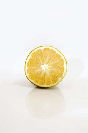 Half orange isolated over whiteの写真素材